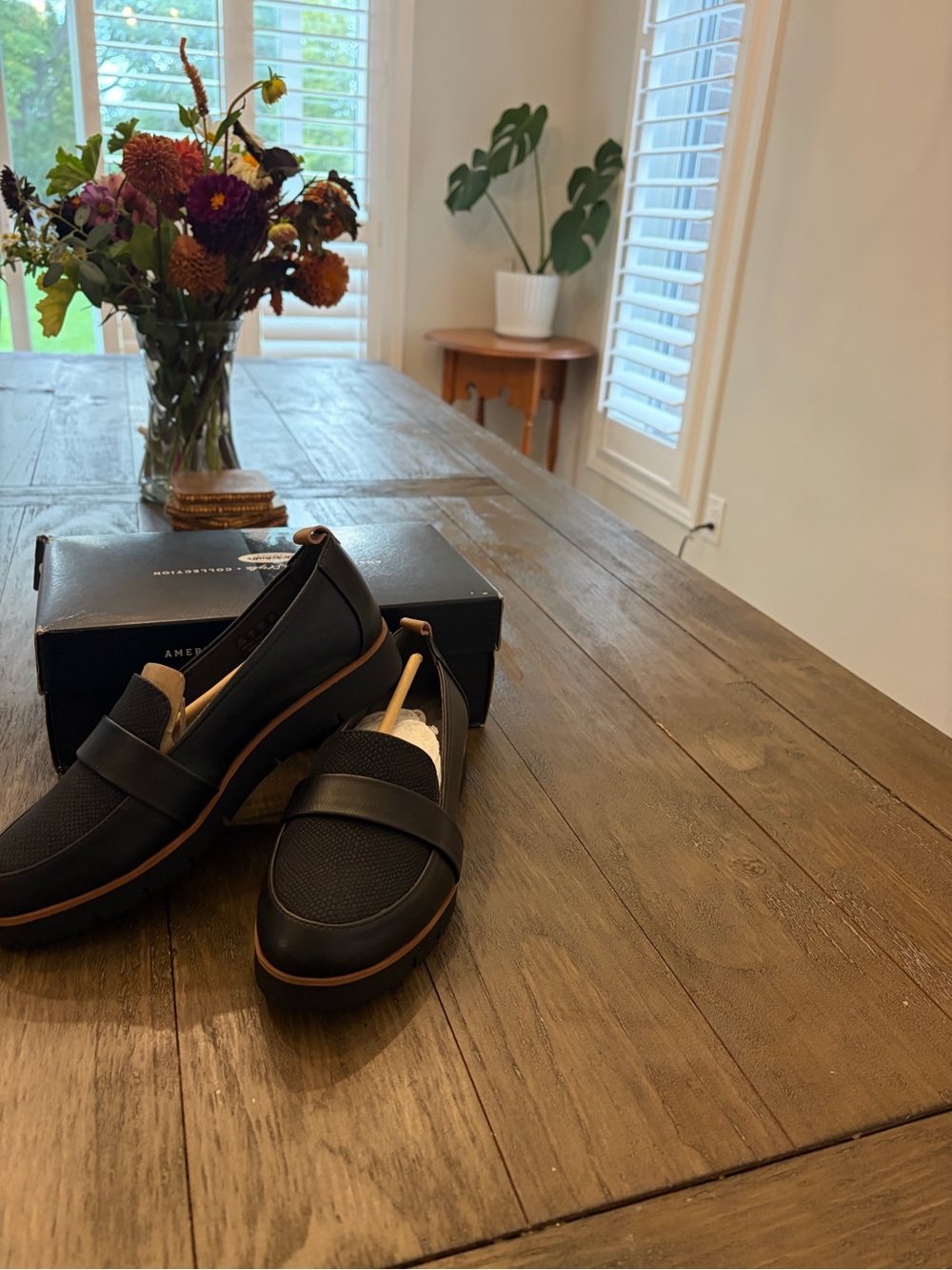 Woman’s Black Slip-On Loafers with Brown Trim